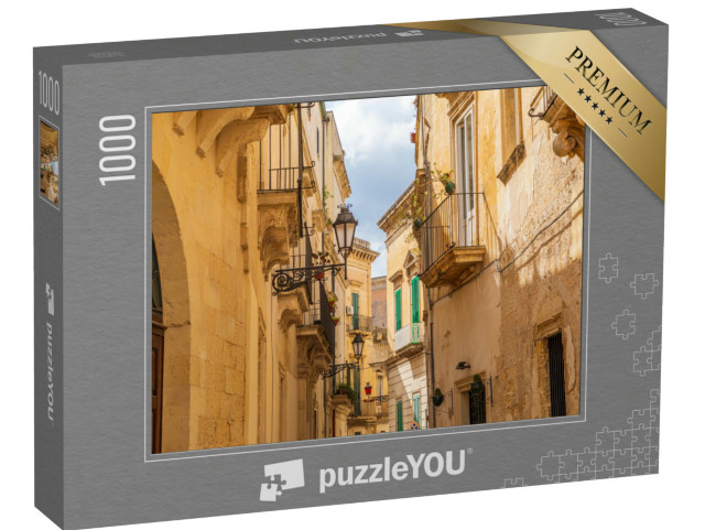 Puzzle 1000 pezzi „Italia, Puglia, Provincia di Lecce, Lecce. Edifici in pietra e balconi in ferro lungo una strada stretta.“