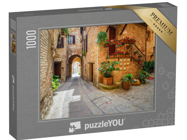 Puzzle 1000 pezzi „Bella strada antica con decorazioni floreali nella città di Spello, Umbria, Italia“