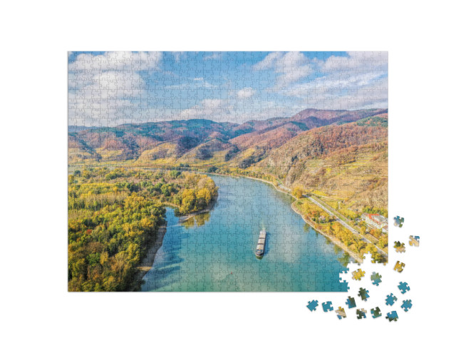 Puzzle 1000 pezzi „Panorama della Valle di Wachau con un battello sul Danubio“