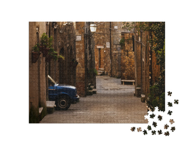 Puzzle 1000 pezzi „Auto blu sulle strade del centro storico di Pitigliano“