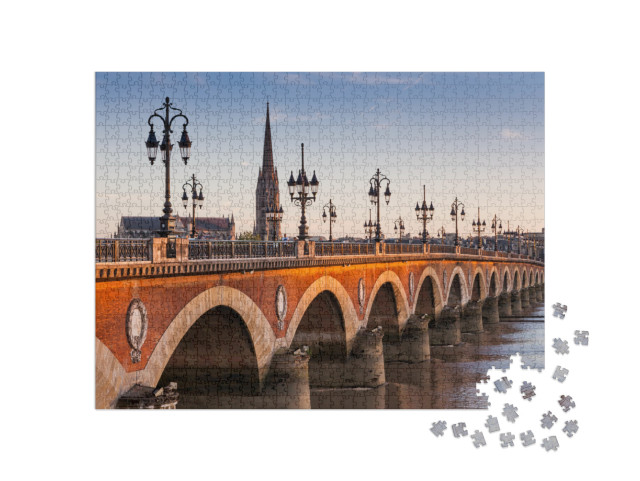 Puzzle 1000 pezzi „Vista del Pont de pierre al tramonto, Bordeaux, Francia“