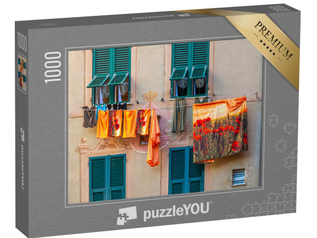 Puzzle 1000 pezzi „Facciata di una casa tipica di Camogli, con panni colorati stesi ad asciugare“