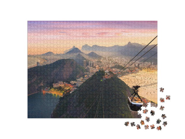 Puzzle 1000 pezzi „Vista notturna di Copacabana con il Pan di Zucchero, Brasile“