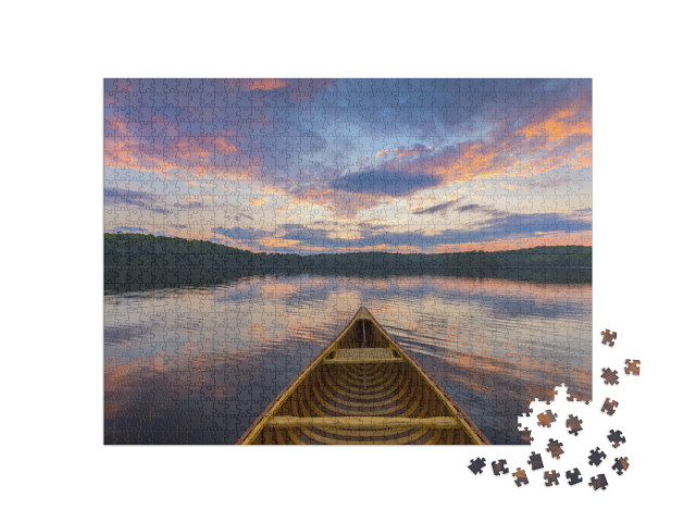 Puzzle 1000 pezzi „Prua di una canoa di cedro al tramonto, Ontario, Canada“