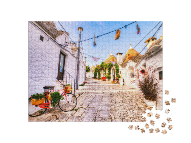 Puzzle 1000 pezzi „Famose case a trulli in una giornata di sole con cielo azzurro ad Alberobello, Puglia, Italia“