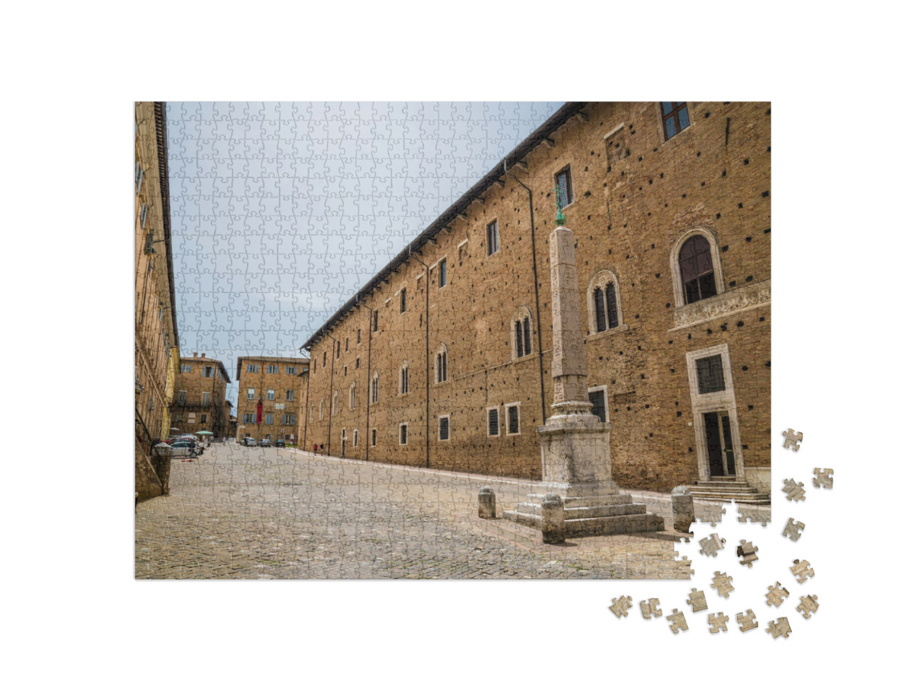 Puzzle 1000 pezzi „Una veduta di via Puccini, nel centro della città di Urbino, in estate.“