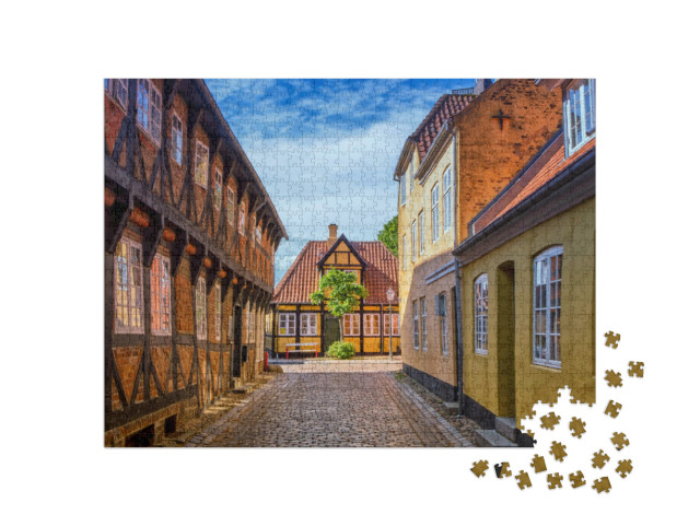 Puzzle 1000 pezzi „Strada e case della città medievale di Ribe in Danimarca“