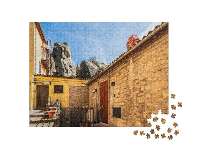 Puzzle 1000 pezzi „Castelmezzano, Potenza: vedute del centro storico e del paesaggio che circonda il paese“