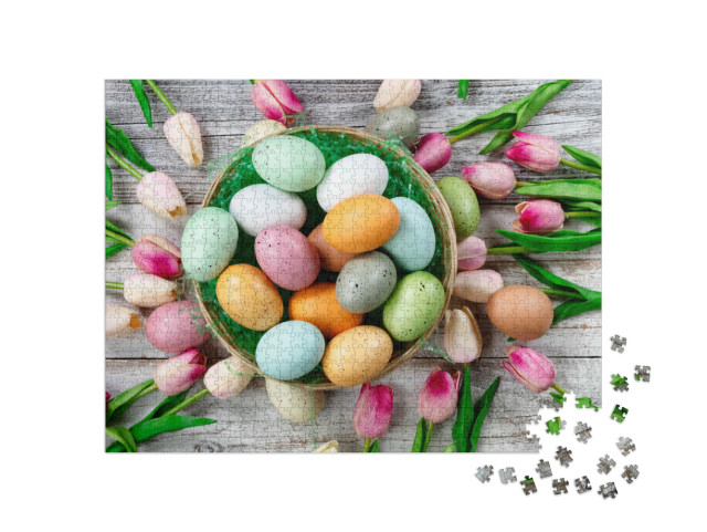 Puzzle 1000 pezzi „Uova di Pasqua colorate in un nido con tulipani“