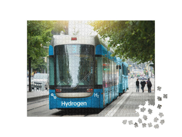Puzzle 1000 pezzi „Un tram a celle a combustibile a idrogeno è parcheggiato presso la stazione“