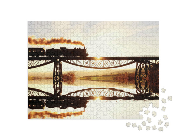Puzzle 1000 pezzi „La storica locomotiva a vapore in viaggio sul fiume“