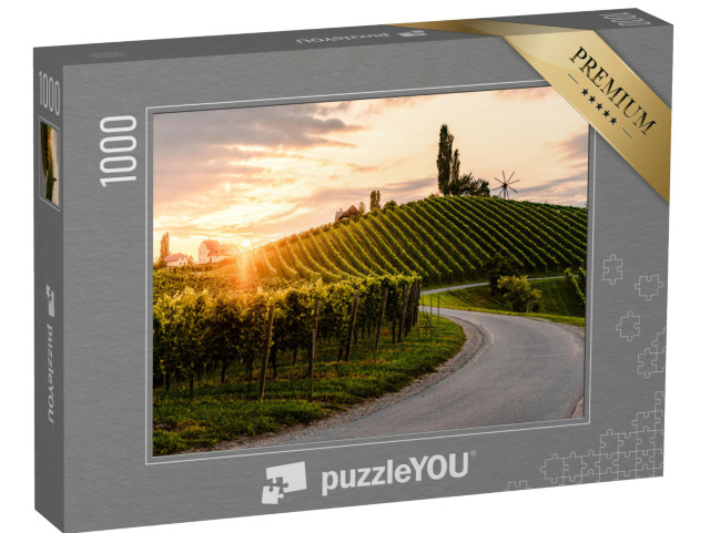 Puzzle 1000 pezzi „Strada asfaltata tra i vigneti dell'Austria meridionale nella Stiria meridionale“