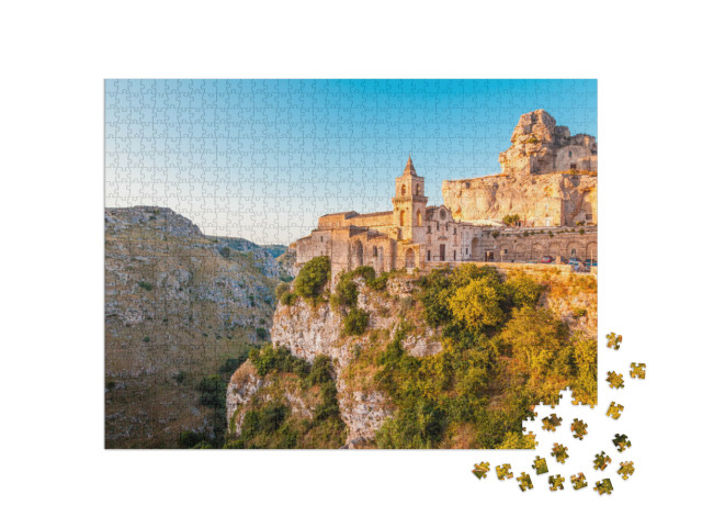 Puzzle 1000 pezzi „Vista panoramica dell'antica città di Matera nella splendida luce dorata del mattino all'alba, Basilicata“