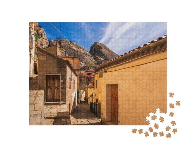 Puzzle 1000 pezzi „Castelmezzano, Potenza: vedute del centro storico e del paesaggio che circonda il paese, Italia“