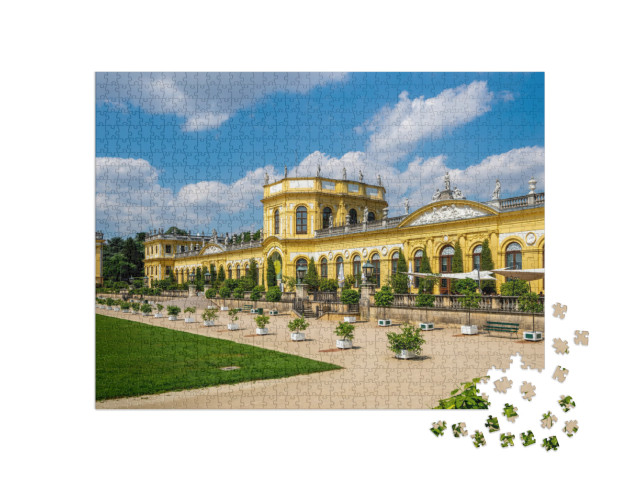 Puzzle 1000 pezzi „Aranciera storica nel parco Karlsaue a Kassel, Germania“