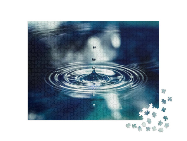 Puzzle 1000 pezzi „Una goccia d'acqua blu schizza in alto“