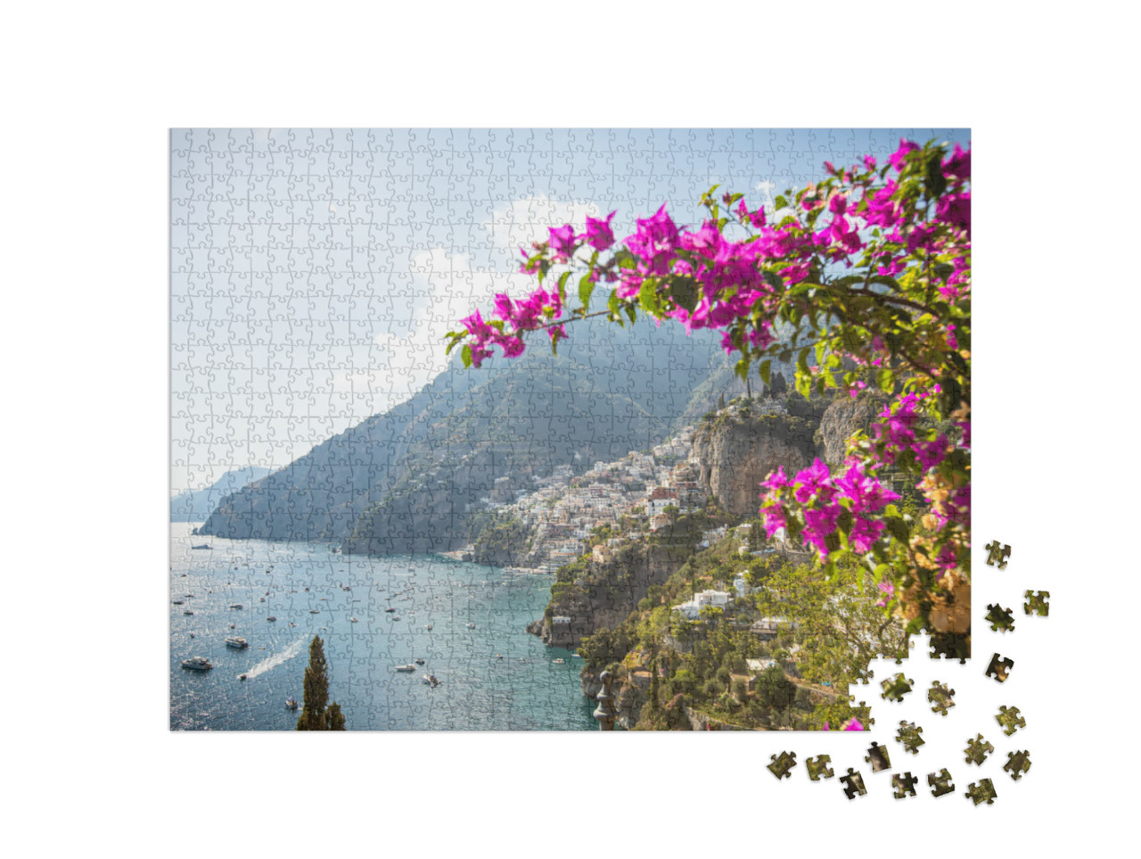 Puzzle 1000 pezzi „La città di Positano vista da lontano. Con fiori rosa.“