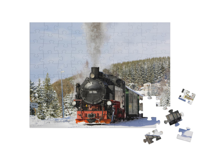 Puzzle 100 pezzi „Treno a vapore della ferrovia del Fichtelberg presso Oberwiesenthal, Germania“