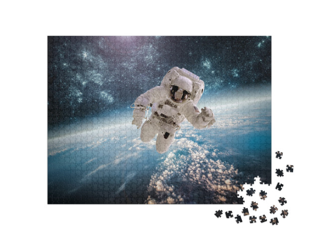 Puzzle 1000 pezzi „Astronauta nello spazio, la Terra sullo sfondo“