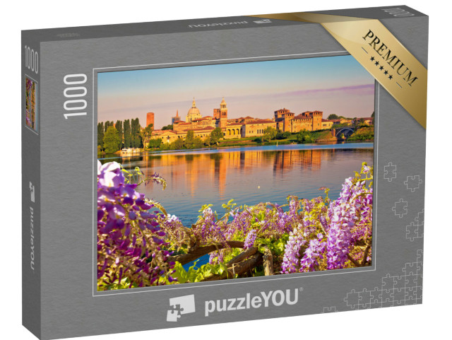 Puzzle 1000 pezzi „Vista mattutina dello skyline di Mantova attraverso i fiori dal Lago Inferiore“