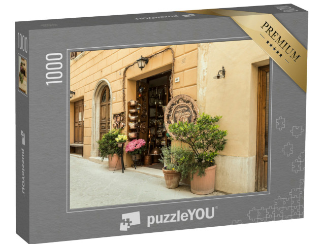 Puzzle 1000 pezzi „Un negozio di piatti in metallo nella cittadina italiana di Montepulciano, Toscana, Italia“