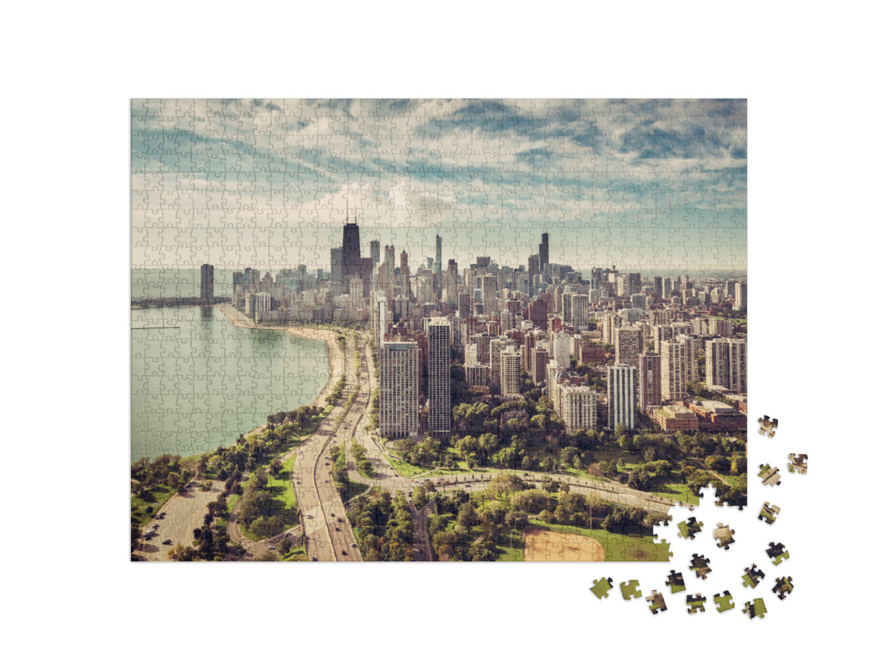 Puzzle 1000 pezzi „Lo skyline di Chicago con la strada sulla spiaggia dall'alto“