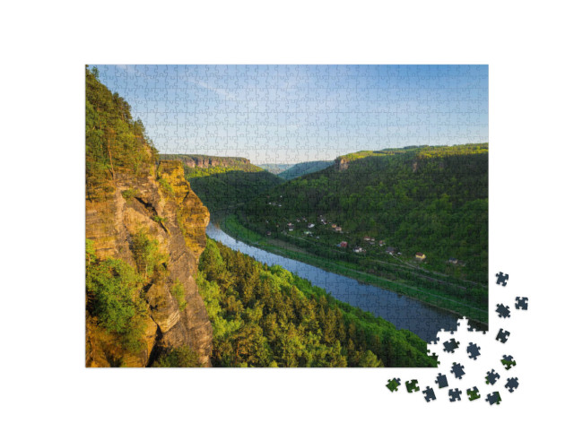 Puzzle 1000 pezzi „Scogliere di arenaria e foreste al sole della sera, Elba“