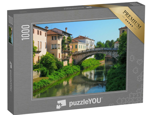 Puzzle 1000 pezzi „Storico ponte in pietra su un tranquillo canale a Vicenza, Italia“