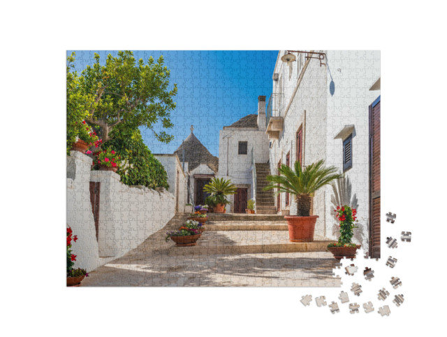 Puzzle 1000 pezzi „Famosa casa a trullo tradizionale in pietra a secco con tetto conico ad Alberobello, Italia.“