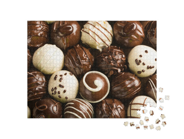 Puzzle 1000 pezzi „Una selezione di deliziose praline di cioccolato“