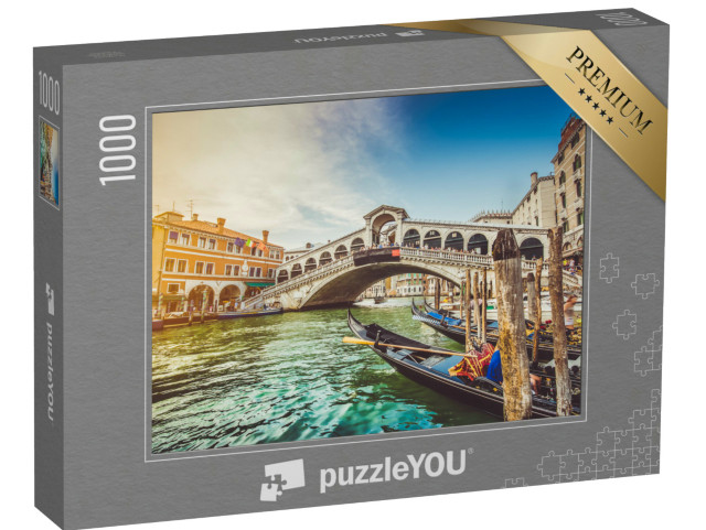 Puzzle 1000 pezzi „Vista panoramica del Canal Grande con il famoso Ponte di Rialto al tramonto a Venezia“