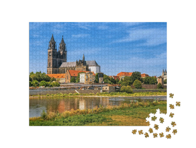 Puzzle 1000 pezzi „Panorama del centro storico di Magdeburgo con la cattedrale e il fiume Elba“