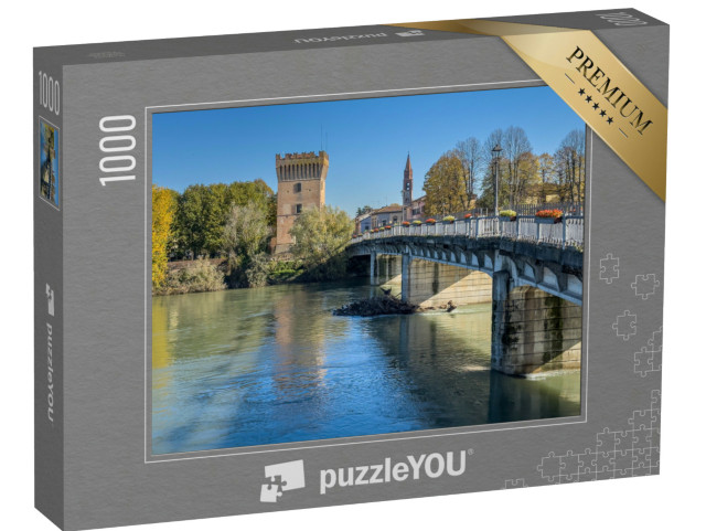 Puzzle 1000 pezzi „Ponte che attraversa il fiume Adda a Pizzighetone, pittoresca cittadina in provincia di Cremona“