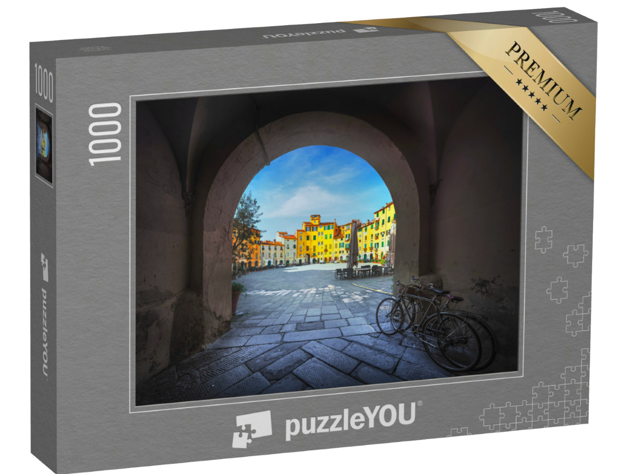 Puzzle 1000 pezzi „Lucca, la storica Piazza dell'Anfiteatro con l'arco d'ingresso e due vecchie biciclette. Toscana, Italia“