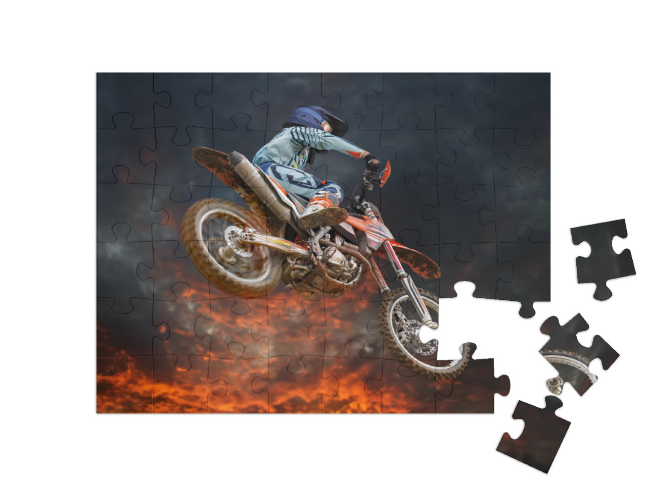 Puzzle 48 pezzi „Acrobazia di motocross sotto un cielo serale incandescente“