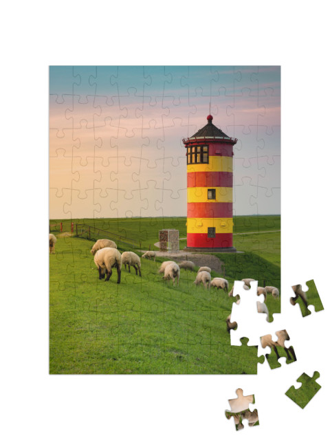 Puzzle 100 pezzi „Un bellissimo faro sulla costa della Frisia orientale“