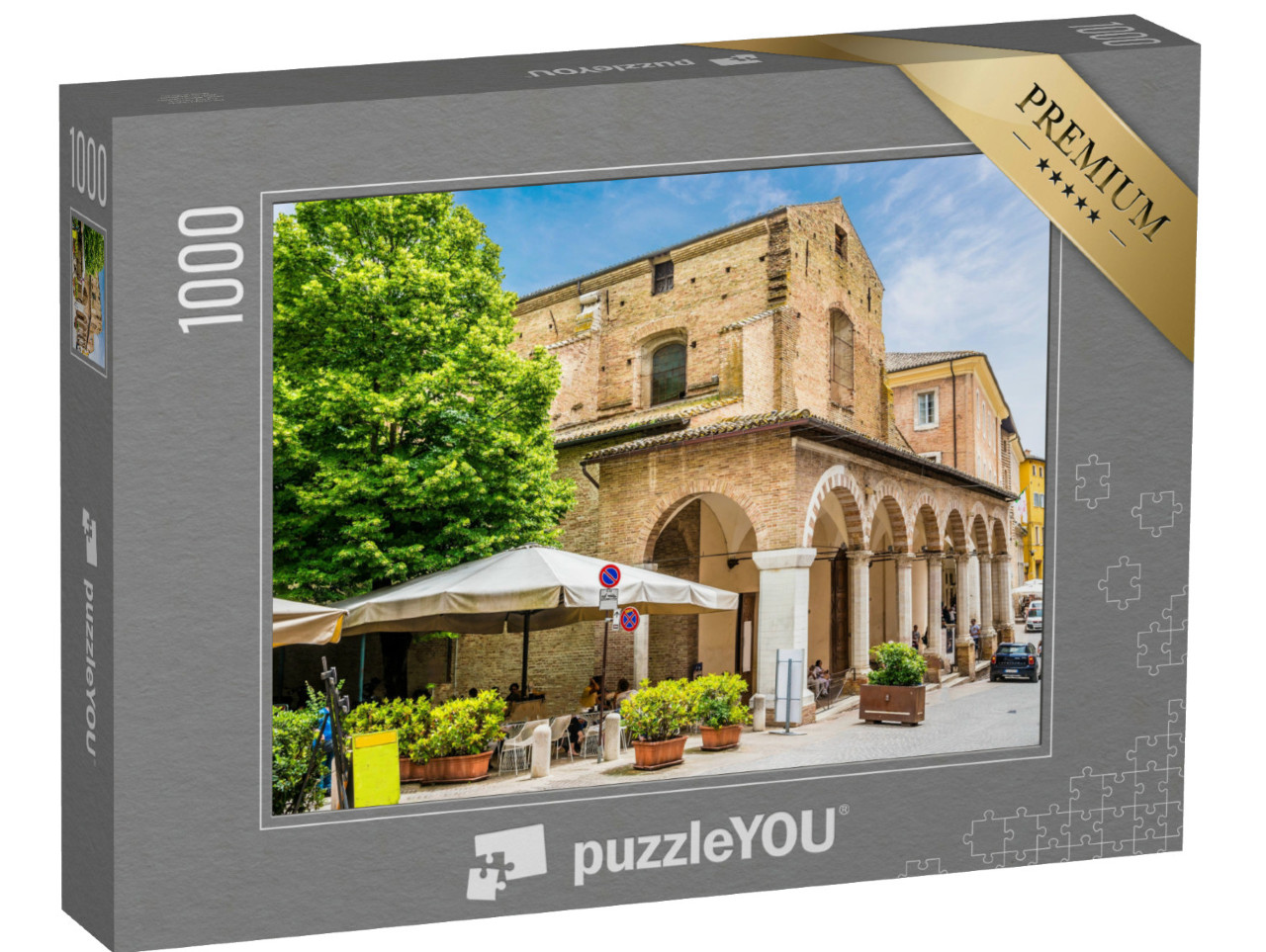 Puzzle 1000 pezzi „Una vista verso il lato di Piazza Roma, nel centro della città di Urbino, in estate.“