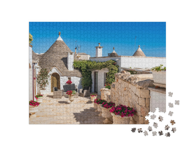 Puzzle 1000 pezzi „Famosa casa a trullo tradizionale in pietra a secco con tetto conico ad Alberobello“