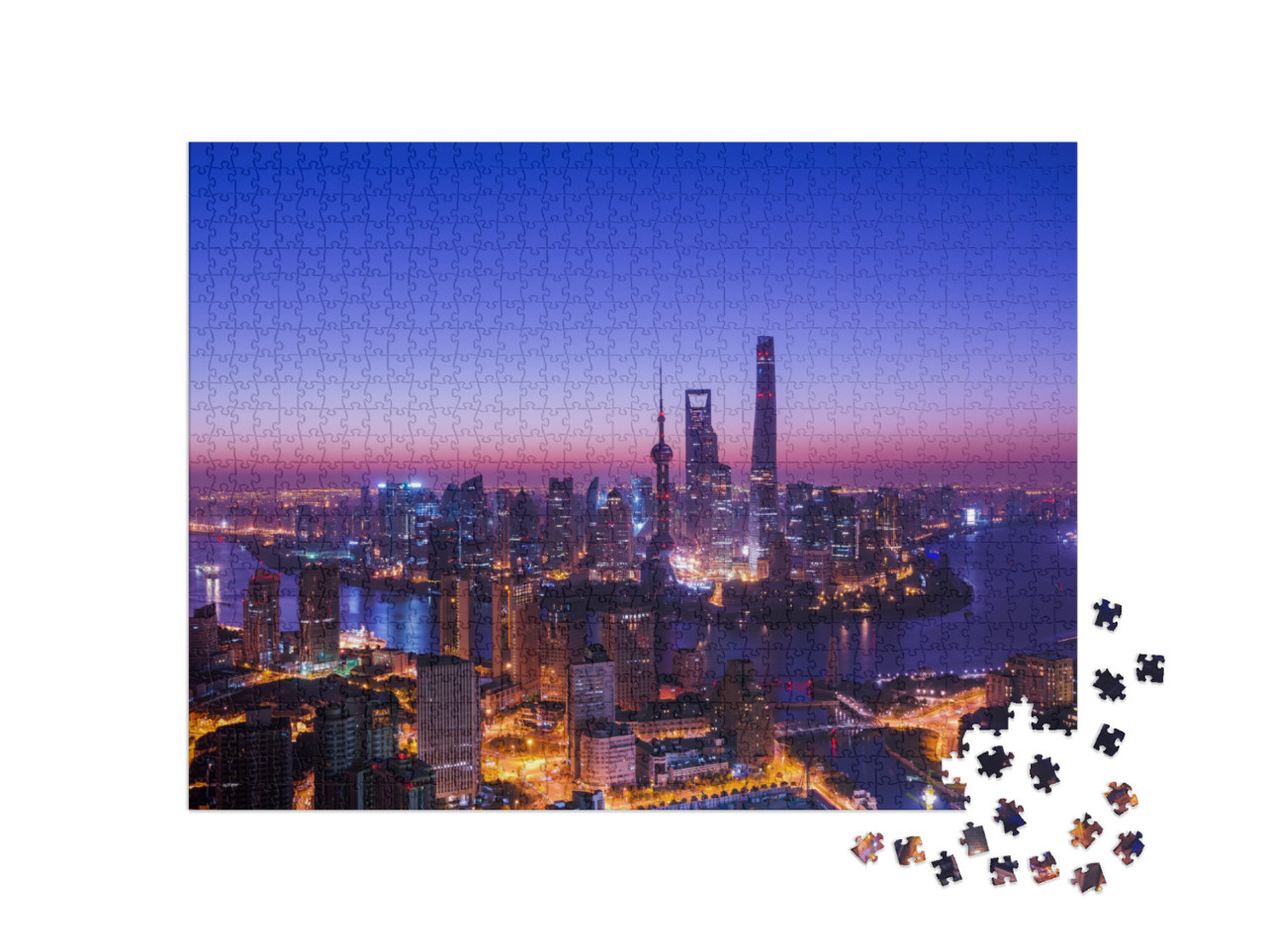 Puzzle 1000 pezzi „Lo skyline di Shanghai nella luce blu-rossa della sera“