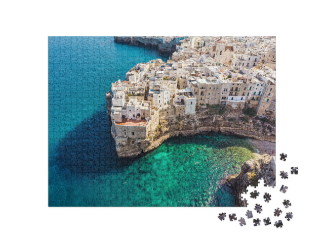 Puzzle 1000 pezzi „Persone che si bagnano al sole nella Laguna Blu, spiaggia di Polignano a Mare“