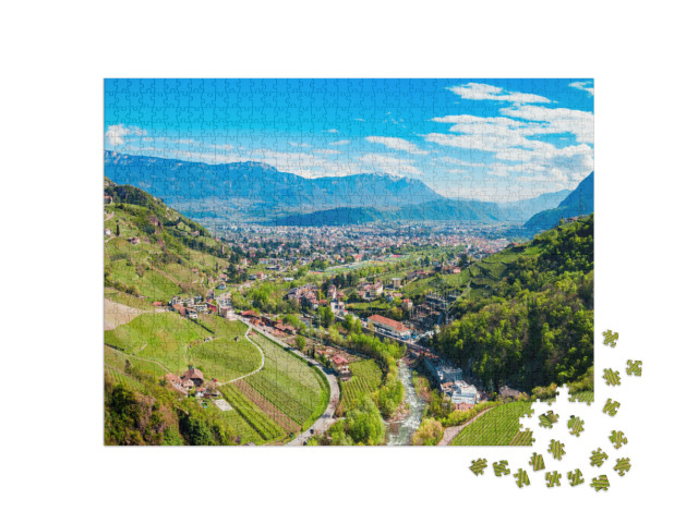 Puzzle 1000 pezzi „Vista panoramica a volo d'uccello su Bolzano e sulle Dolomiti“